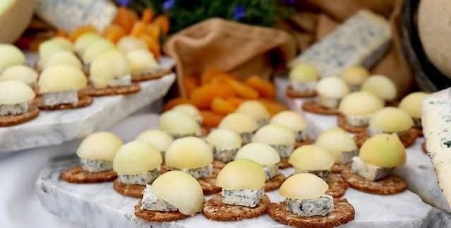 Artisanal cheese samples served on crackers at the San Francisco Cheese Fest.